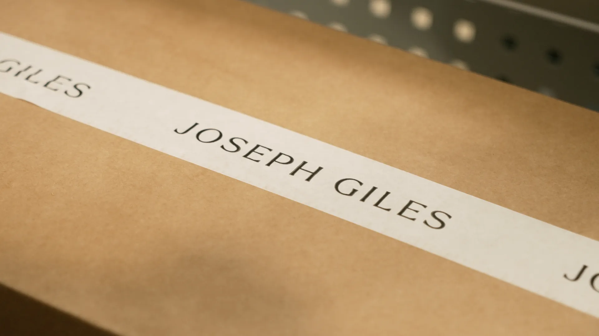 Box with Joseph Giles branded tape