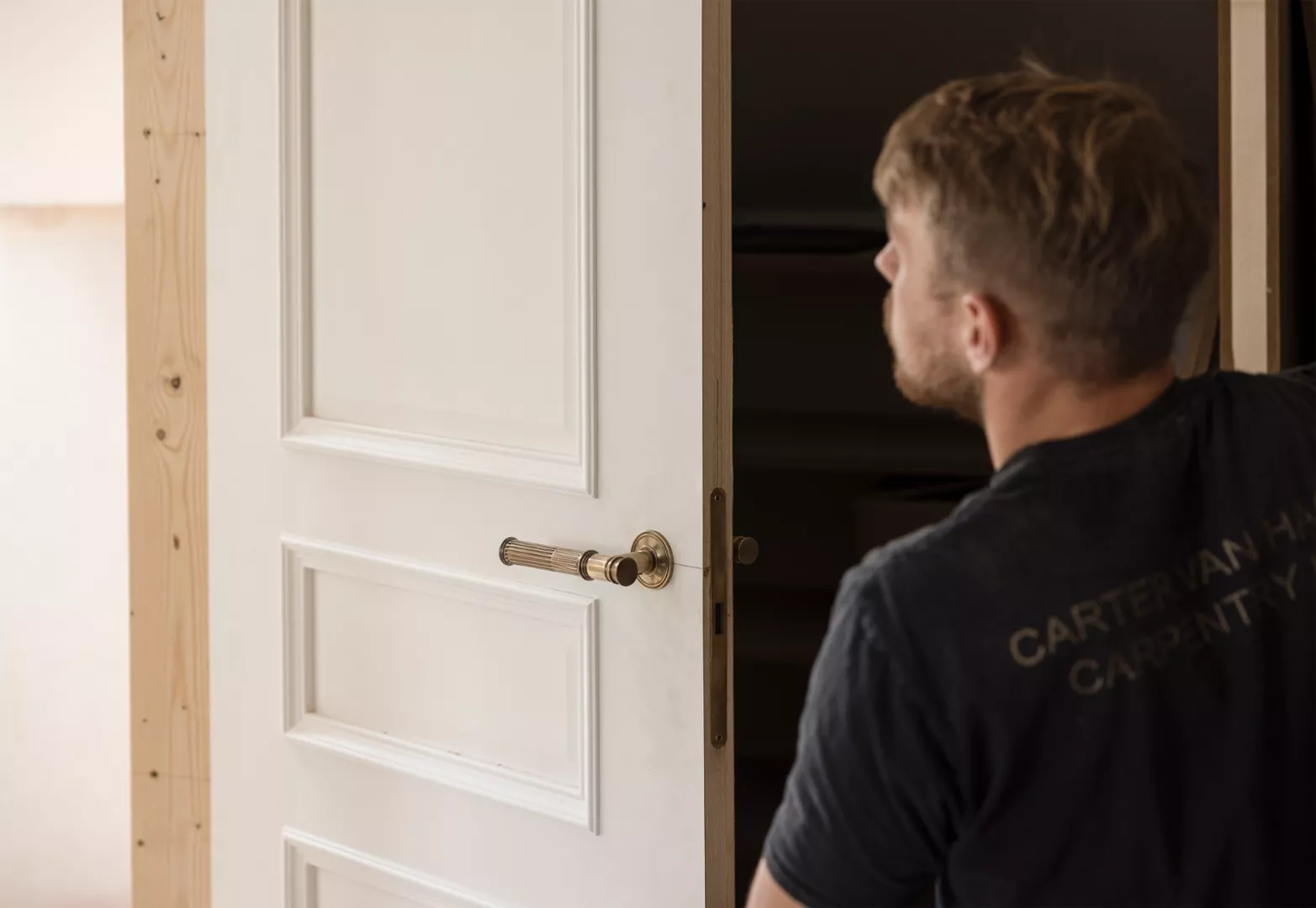 Image of the Hamilton lever (LV1990) being installed into a white door.