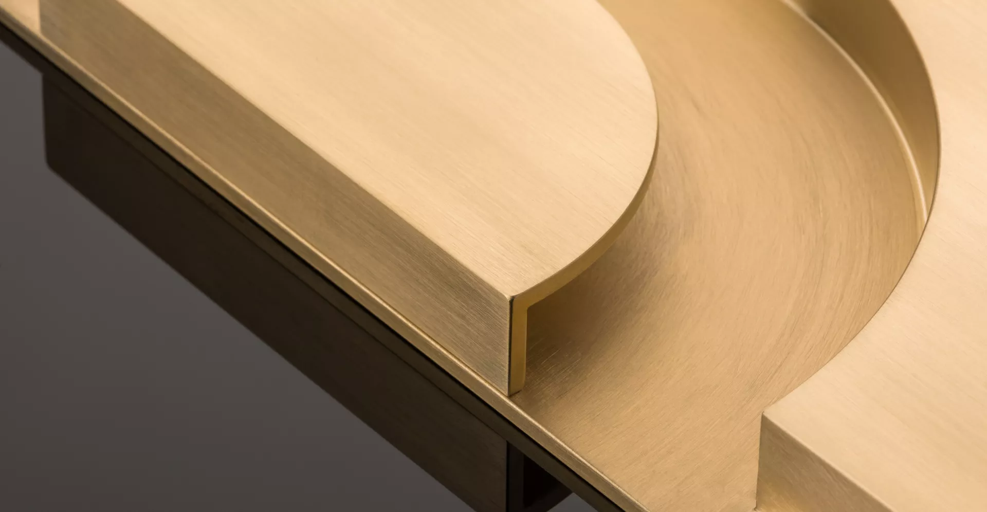 KH Dot Cabinet Handle (CH1120) in Brushed Brass Waxed - BBW on Black (Web Crop)