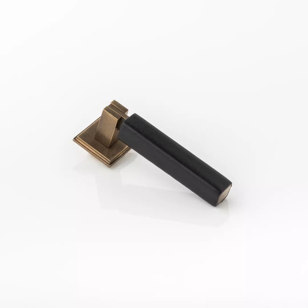 Cube & Leather Drop Solid Brass Swing Cabinet Pull (CP1085) in Mid Antique Brass Waxed - MABW & JGL06 on a white background.