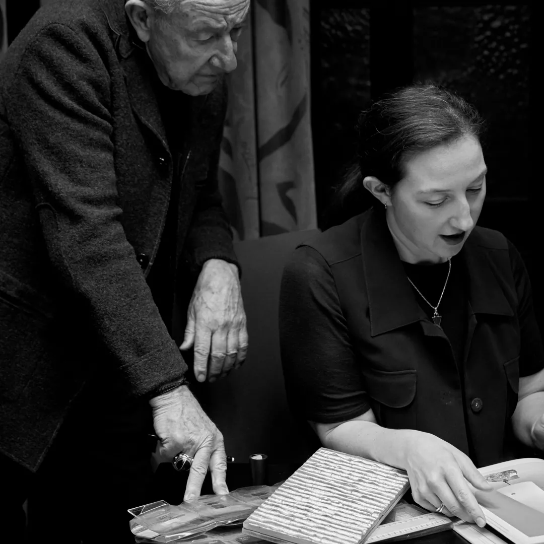 Picture of Anthony Collett and Georgia Collett looking at materials.