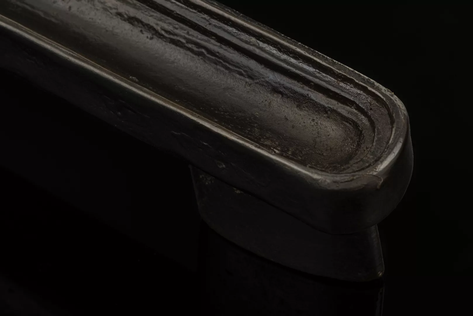 Tiro Cabinet Handle (CH1128) in Dark Bronze Waxed - DBZW on a black background