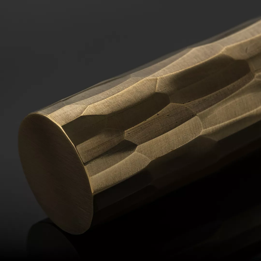 Rolled & Hammered Texture on a black background in Mid Antique Brass Waxed - MABW