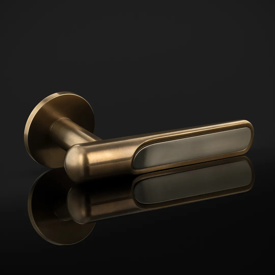 Arty Shot of Contour Lever with brass inlay (LV1217) in Mid Antique Brass Waxed - MABW & Brushed Nickel - BN