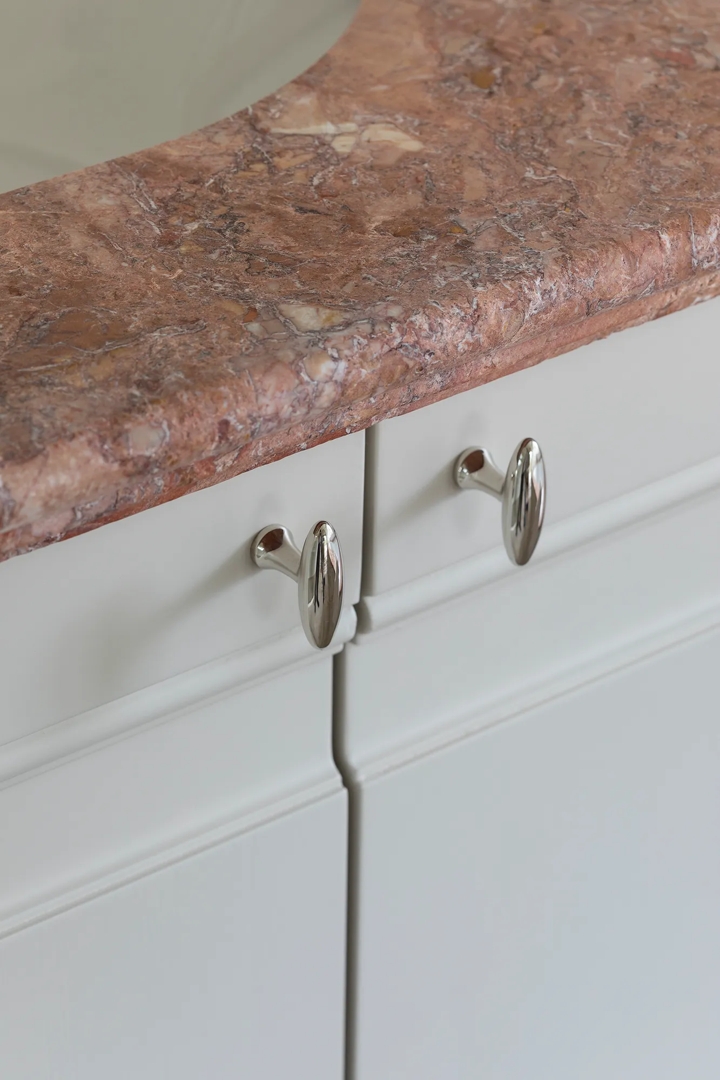 Arendonk - Bathroom with Close Up of Buckland Cabinet Pull (CP1138) in Polished Nickel - PN