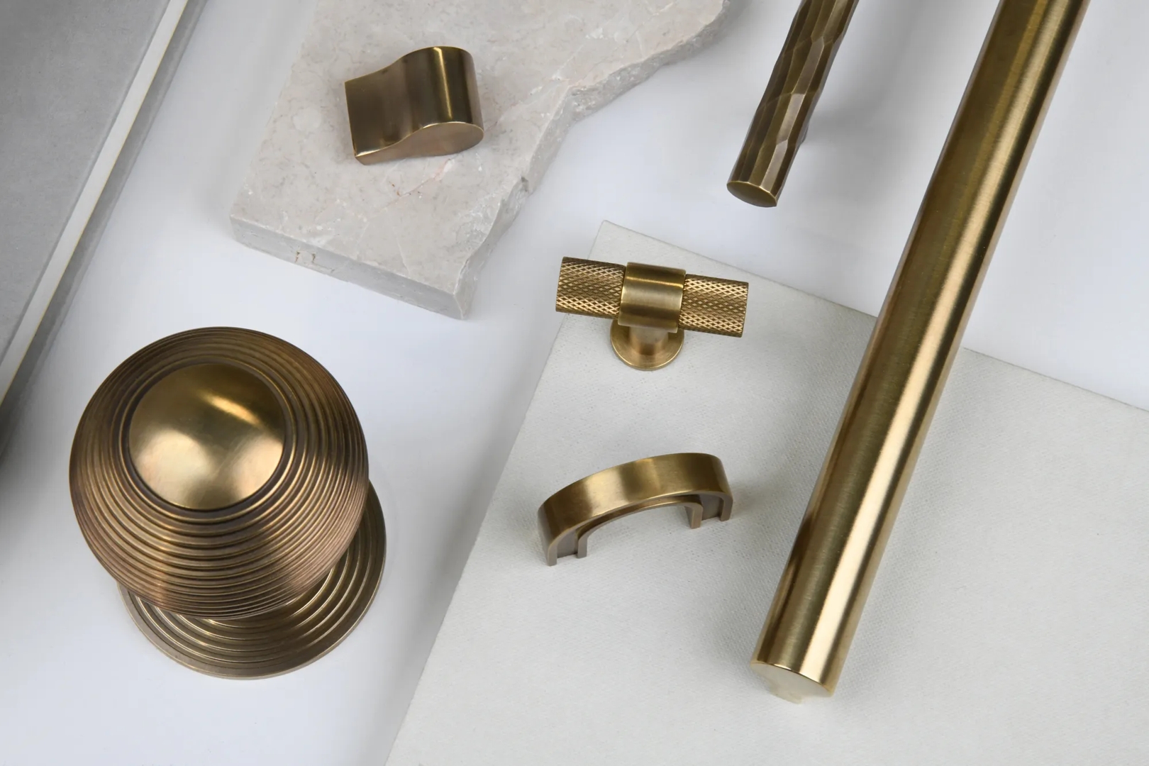 Assorted Mid Antique Brass Waxed - MABW hardware flat lay, used for Design et Al ad Q3 2024