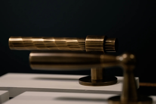 Sample levers on plinths - Rolled & Hammered Lever (LV1047) & Bennett Lever (LV1001) in Mid Antique Brass Waxed - MABW