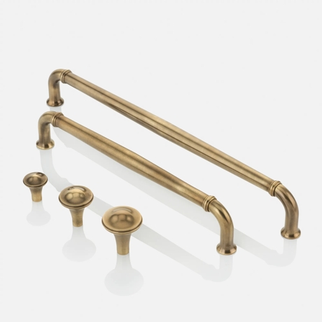 Group Shot of Darlington Cabinet Handles (CH1130) & Cabinet Pulls (CP1164) in Mid Antique Brass Waxed - MABW on 5% background