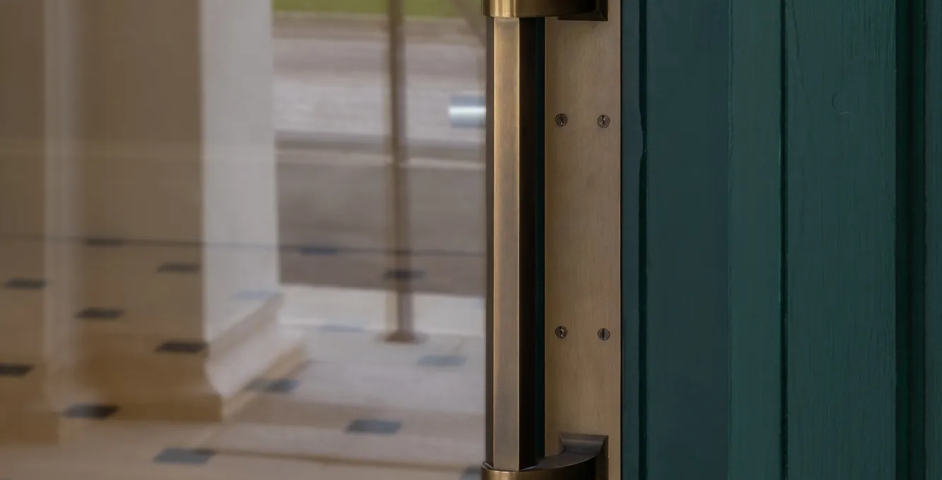 Poundbury - Adelphi Door Pull (DP1015) on bespoke backplate in Mid Antique Brass Waxed - MABW