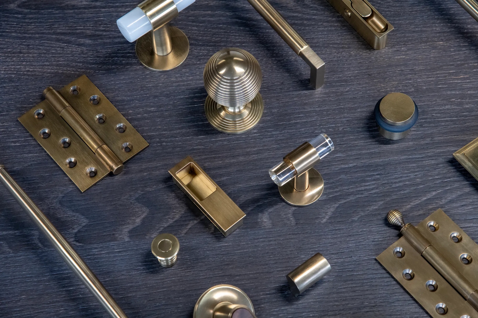 Door and Cabinet Hardware in Mid Antique Brass Waxed - MABW on Flat Lay
