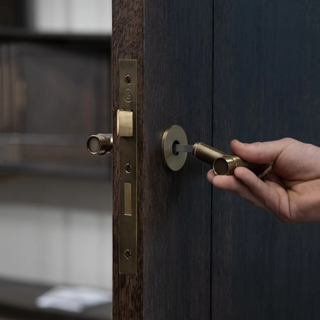 Double Door Installation Shot of Montgomery Lever & Back Plate - Euro Cut Out (LV1212) in Mid Antique Brass Waxed - MABW