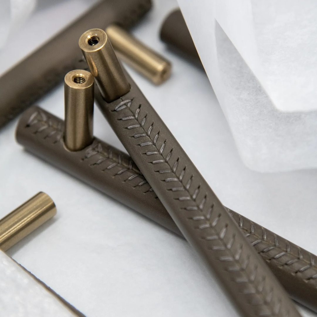 Close up of stitching on Thurloe Leathered Cabinet Handles (CH1048) in Mid Antique Brass Waxed - MABW & Dark Brown Leather - JGL01