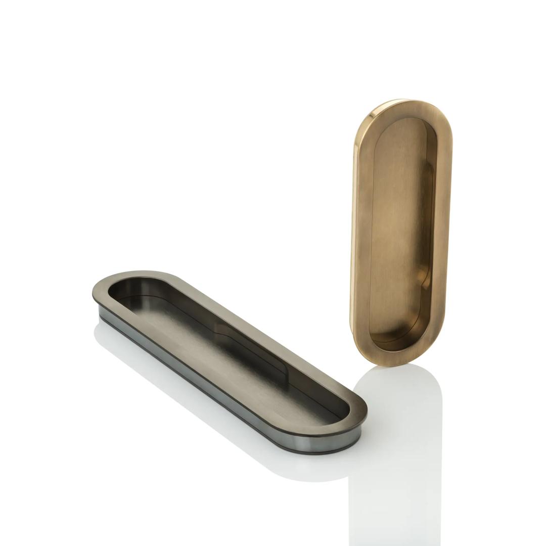 Hero Shot of Maurice Oval Recessed Pulls (SF1092.01 & SF1092.02) in Dark Bronze Waxed - DBZW & Mid Antique Brass Waxed - MABW