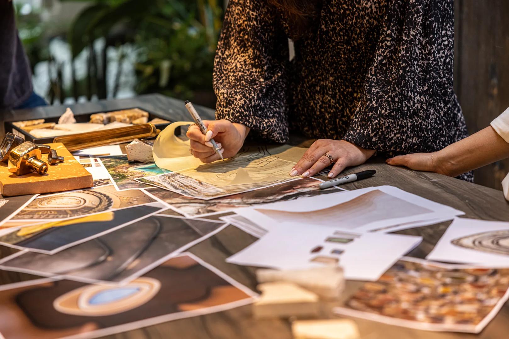 Tiro Inspiration Shoot - looking down on a mood board shot with products from the Tiro collection, a terracotta tile and pieces of stone, with inspiration photos printed