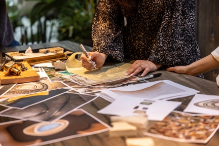 Tiro Inspiration Shoot - looking down on a mood board shot with products from the Tiro collection, a terracotta tile and pieces of stone, with inspiration photos printed