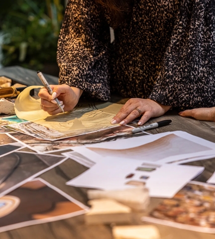 Tiro Inspiration Shoot - looking down on a mood board shot with products from the Tiro collection, a terracotta tile and pieces of stone, with inspiration photos printed