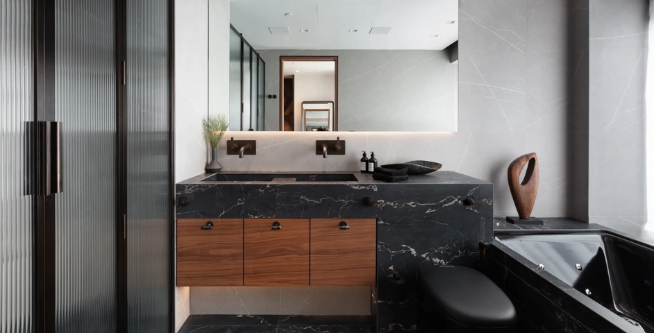 Sugar Quay - Bathroom with Collett Marble Cabinet Pull (CP1105) in Black Portoro - BPM & Dark Bronze Waxed - DBZW on a vanity unit