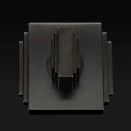 Arty shot of Dewhurst Thumb Turn (TT1059) in Dark Bronze Waxed - DBZW on a dark background